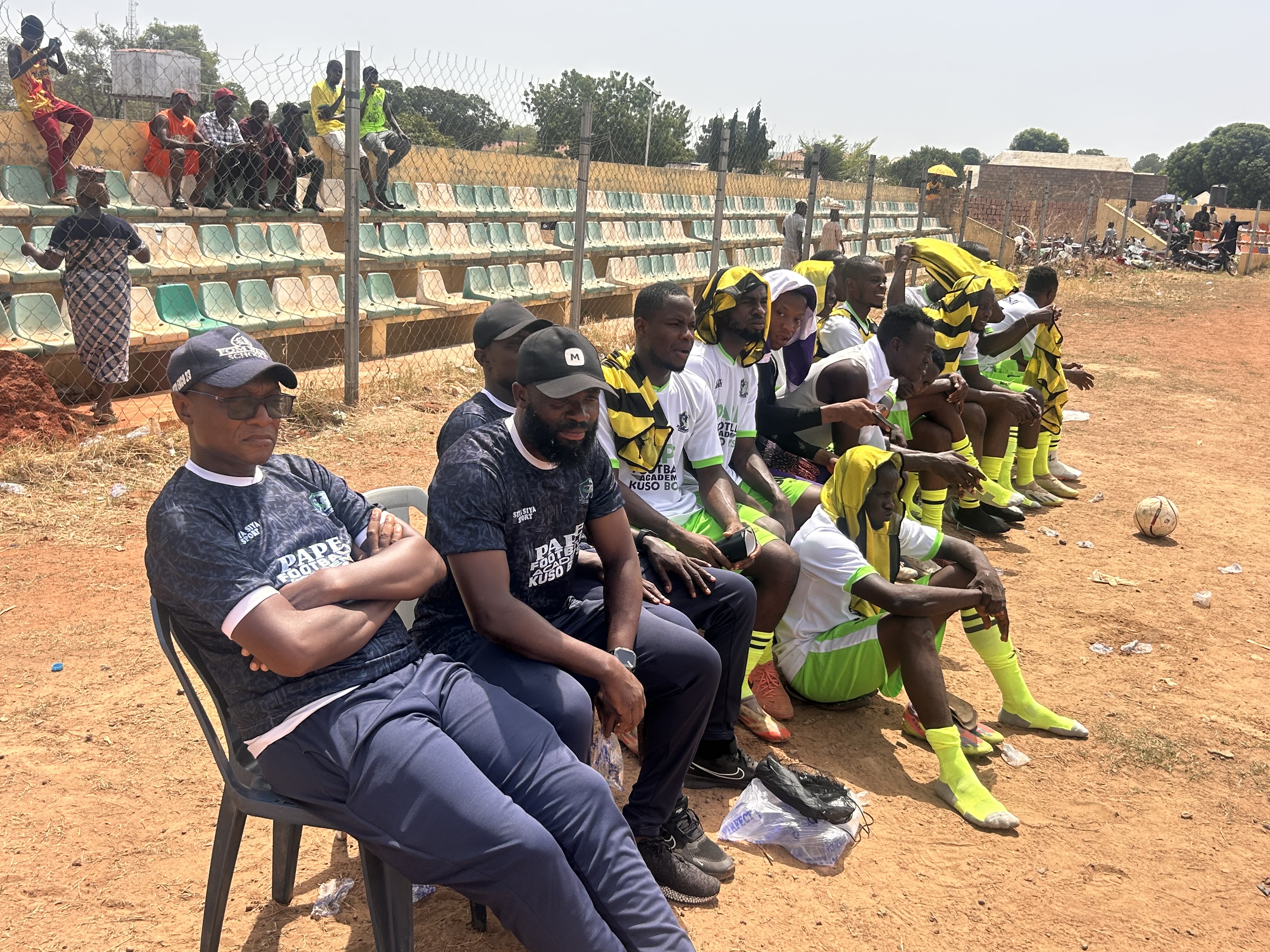 Coaching staff and players on the bench